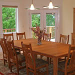 Dining room looks over meadow along the McKenzie River.